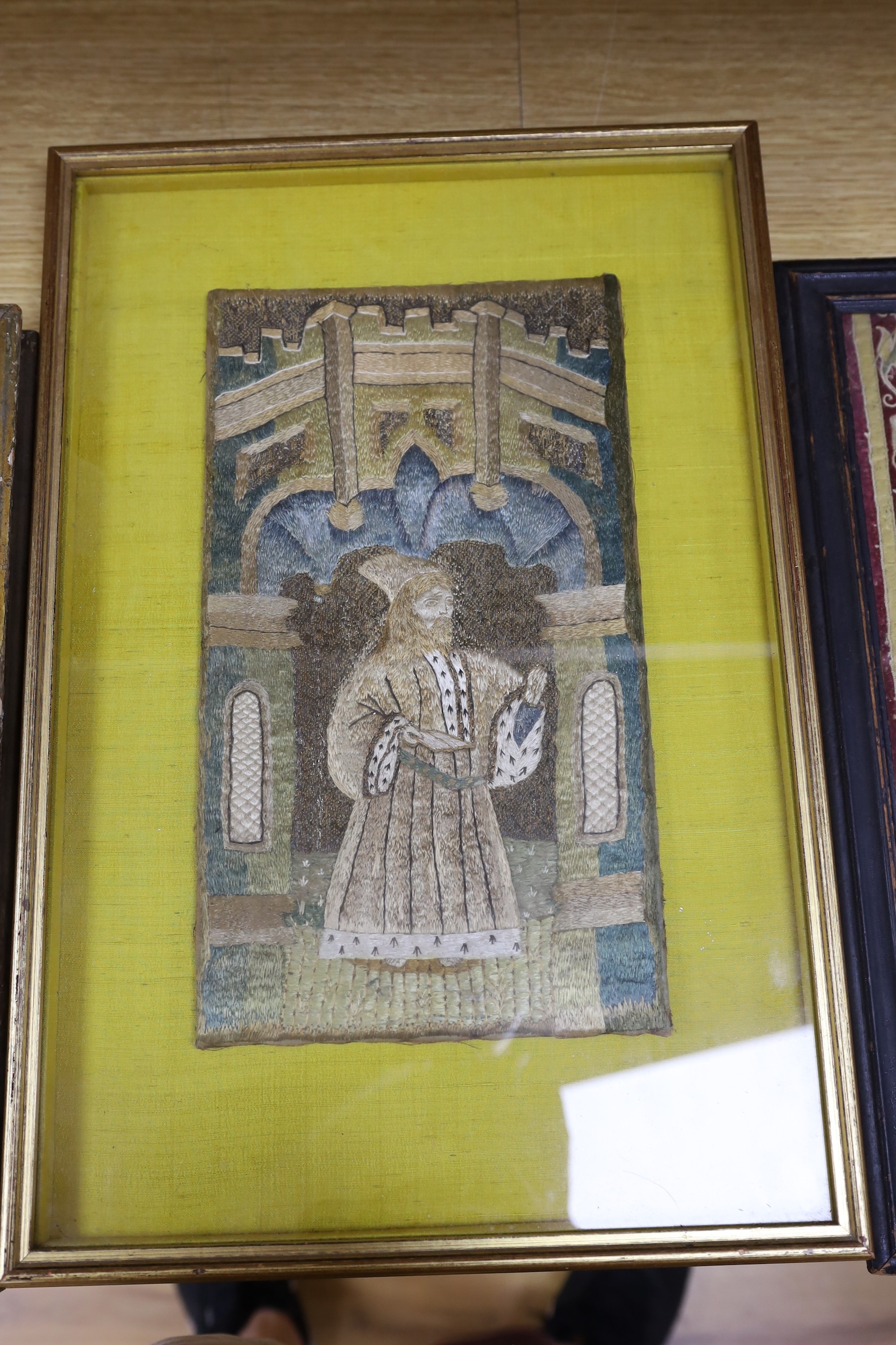 Two 18th century framed silk work religious panels and another later on canvas, largest 39 x 27cm